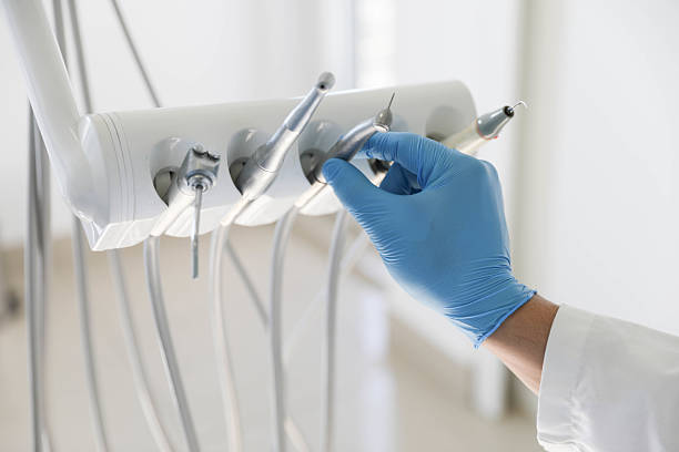 Professional Tooth Extraction technician working in Sault Ste. Marie, MI
